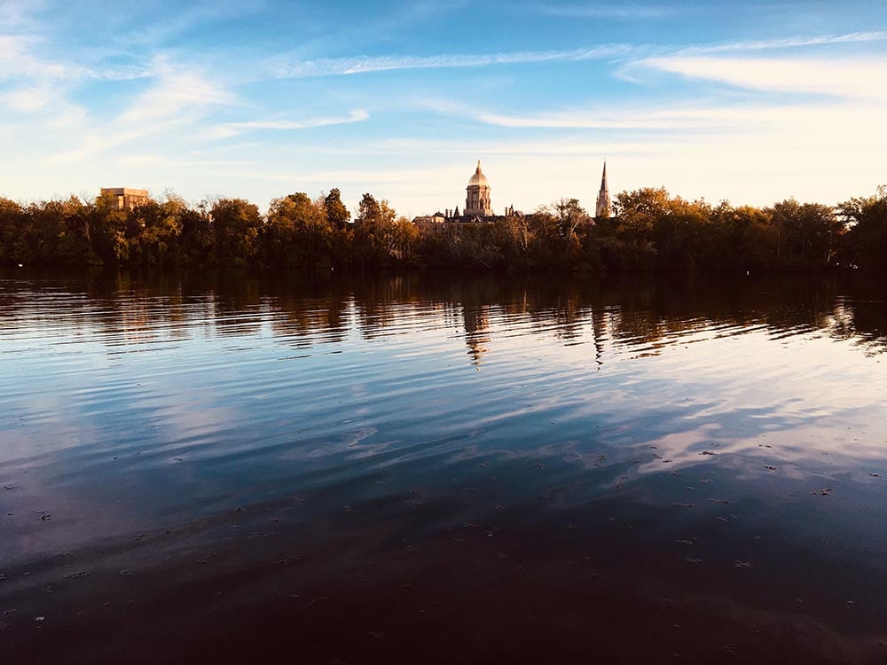 Photo of a lake at sunset in front of Notre Dame University in South Bend, Indiana.