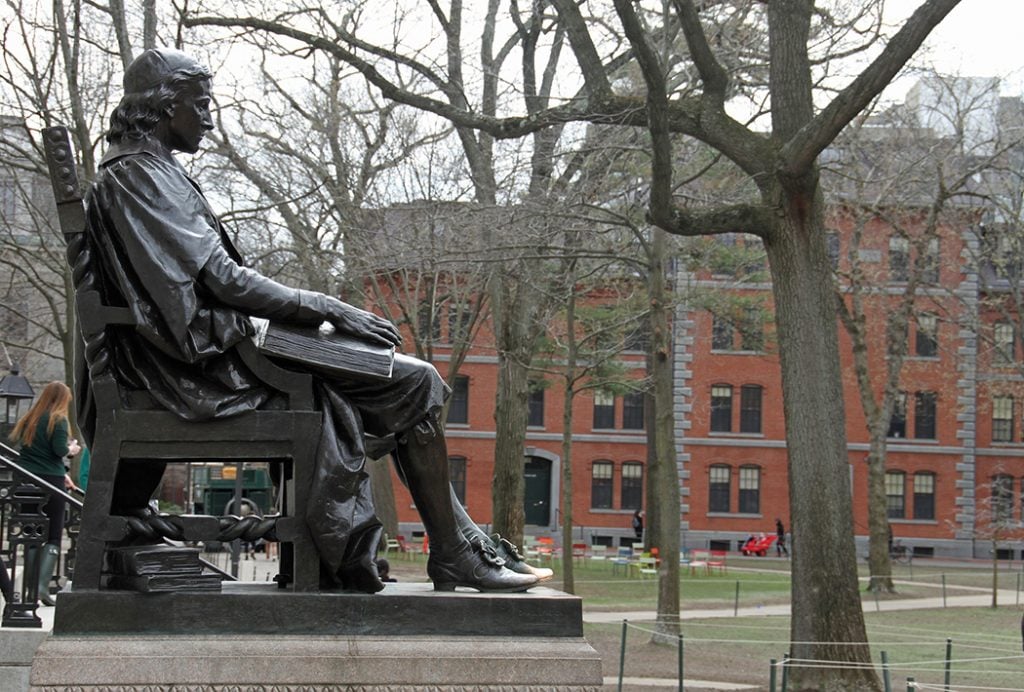 Photo of the John Harvard statue in Cambridge, Massachusetts.