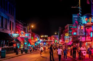 Beale Street in Memphis, Tennessee at night. Memphis is one of the best vacation destinations in Tennessee.