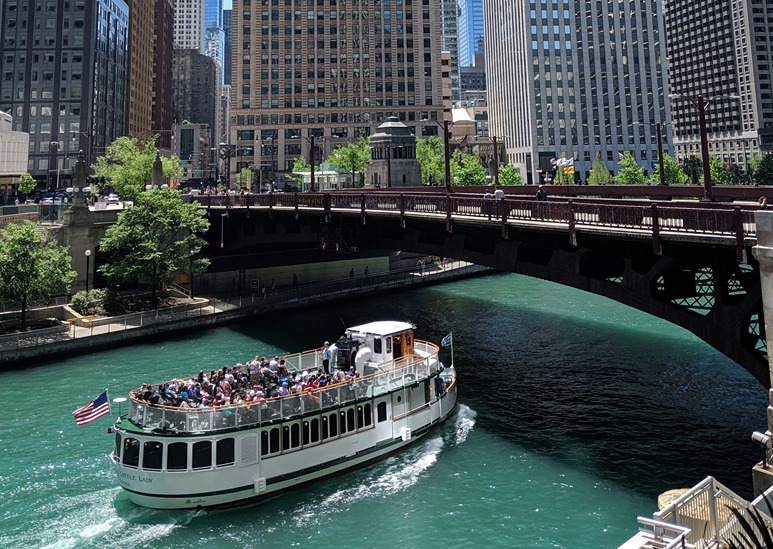 Tour boat going under bridge on the Chicago River