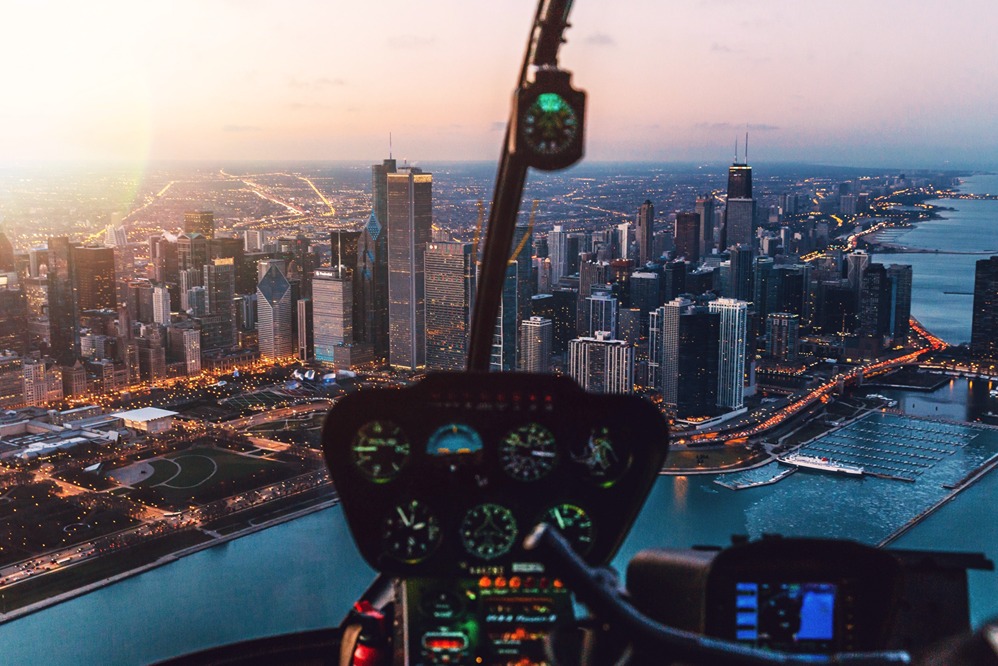 Aerial view of Chicago at dusk from the cockpit of a helicopter