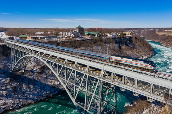 An Amtrak Maple Leaf train crosses over a river