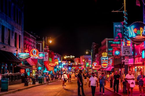 Beale Street in Memphis, Tennessee at night. Memphis is one of the best vacation destinations in Tennessee.
