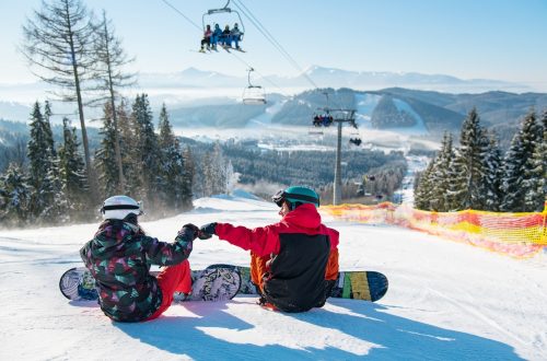 snowboarders-resting-on-top-of-ski-slope-under-the-2026-01-07-01-00-09-utc